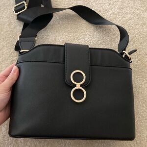 Elegant Black Handbag with Gold Accents